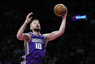 Sacramento Kings' Domantas Sabonis drives to the basket during the first half of the team's NBA basketball game against the Brooklyn Nets on Thursday, March 16, 2023, in New York. (AP Photo/Frank Franklin II)