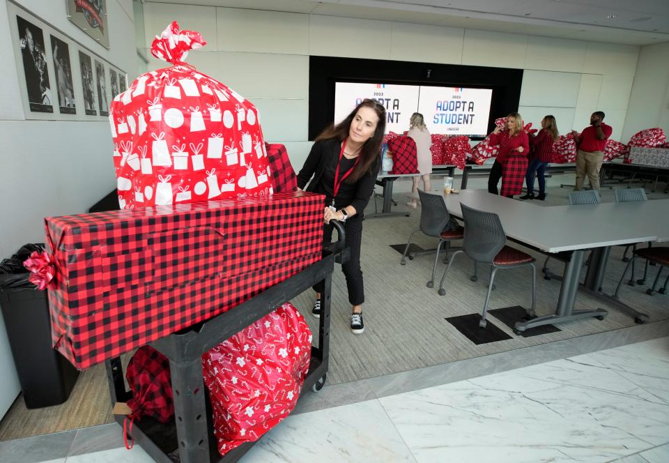 Volusia County Schools student advocate Jennifer Watley prepares to distribute gifts for the Adopt a Student program, Dec.13, 2023.