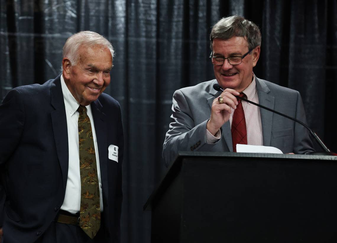 Tommy Moody (right) laughs while introducing former USC baseball coach Bobby Richardson during the South Carolina Hall of Fame Induction Ceremony in Columbia on Thursday, October 12, 2023.