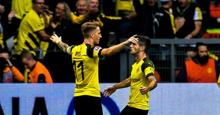 Dortmund captain Marco Reus (L) celebrates after his stunning free-kick flew into the RB Leipzig net via a deflection in Sunday's 3-1 home win