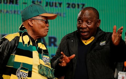 Jacob Zuma (left) chats to Cyril Ramaphosa in June 2017 - Credit: SIPHIWE SIBEKO