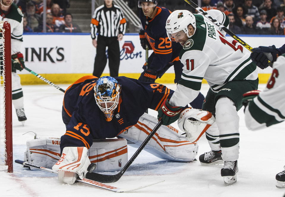 Minnesota Wild's Zach Parise (11) is stopped by Edmonton Oilers goalie Mikko Koskinen (19) during the third period of an NHL hockey game Friday, Feb. 21, 2020, in Edmonton, Alberta. (Jason Franson/The Canadian Press via AP)