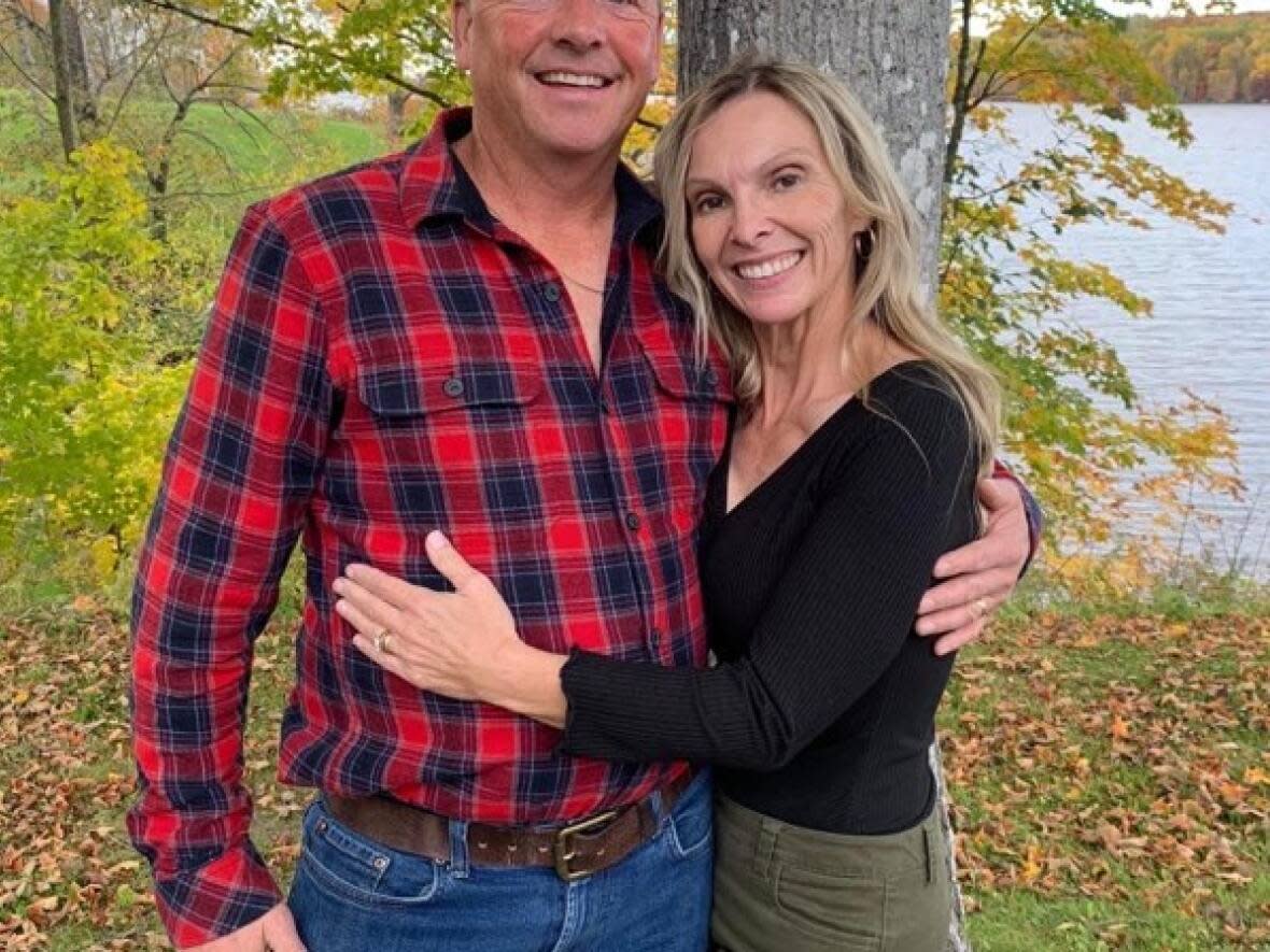 Colin Hume, shown here with his wife Heidi, had an infectious smile and a contagious laugh, say family, friends and coworkers.  (Submitted by Shelley Porter - image credit)