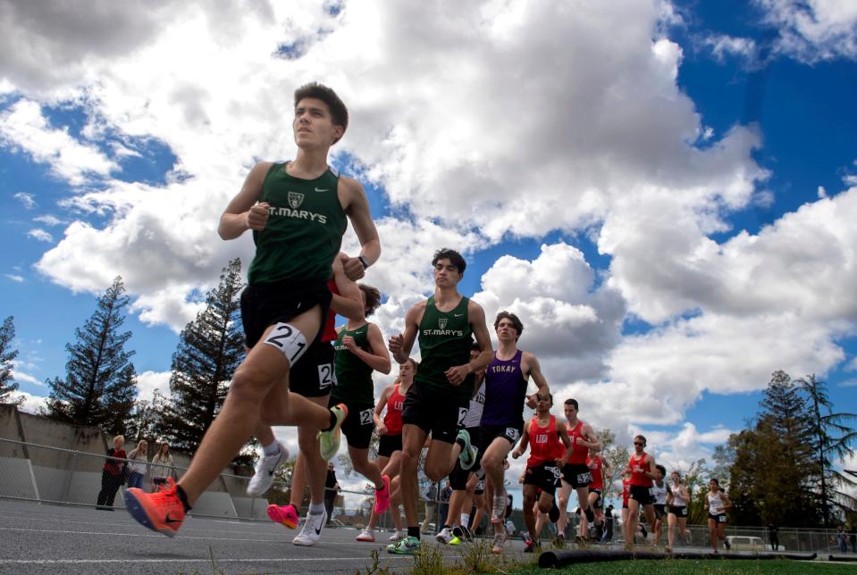 Runners from Tokay, Lodi, St. Mary's and West high schools compete in the 1600 meters during a track meet at Tokay in Lodi on Thursday, Mar. 29, 2023.