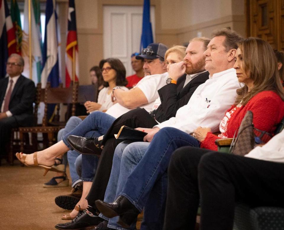 The owners of Fritz & Franz, Harald and James Neuweg, center, attend an item regarding their lease for Fritz & Franz at a Coral Gables City Commission meeting on Tuesday, Jan. 23, 2024, at Coral Gables City Hall.