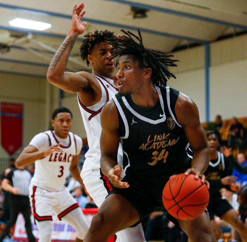 R'Chaun King, of Link Academy, drives to the lane during a game against the Legacy (Texas) Broncos in the Ozark Mountain Shootout at Glendale High School on Thursday, Dec. 8, 2022.