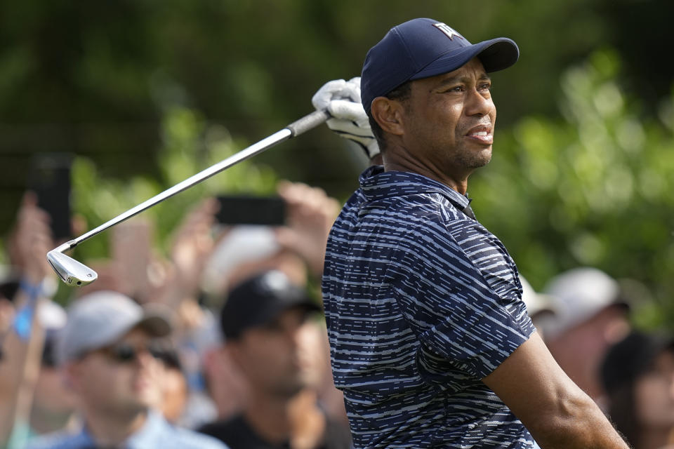 Tiger Woods watches his shot on the 15th hole during the first round of the PGA Championship golf tournament, Thursday, May 19, 2022, in Tulsa, Okla. (AP Photo/Eric Gay)