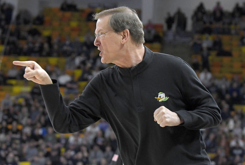 FILE - Oregon head coach Dana Altman yells at his team as they play Utah State in the first half of a National Invitational Tournament college basketball game Tuesday, March. 15, 2022, in Logan, Utah. Oregon heads into the season ranked No. 21 in the preseason AP Top 25. The Ducks are focusing on defense and rebounding, where coach Dana Altman said the team was lacking last season. (Eli Lucero/The Herald Journal via AP, File)