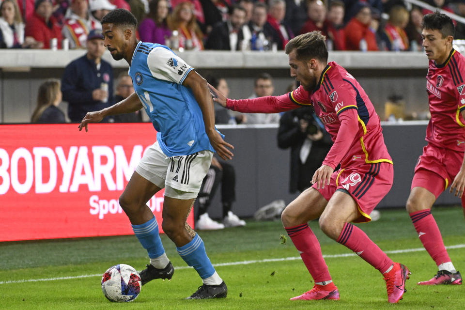 St. Louis City SC midfielder Indiana Vassilev, front right, defends against Charlotte FC midfielder McKinze Gaines, left, during the second half of an MLS soccer match Saturday, March 4, 2023, in St. Louis. (AP Photo/Joe Puetz)
