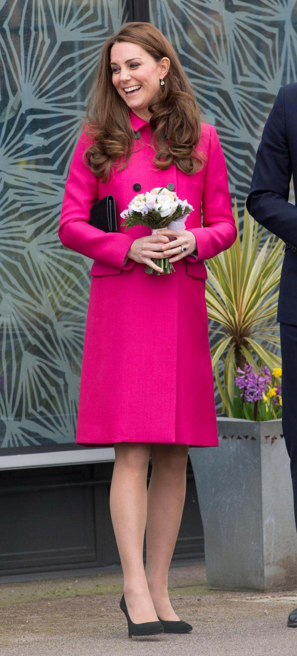 Kate Middleton wears a pink coat in March 2015.