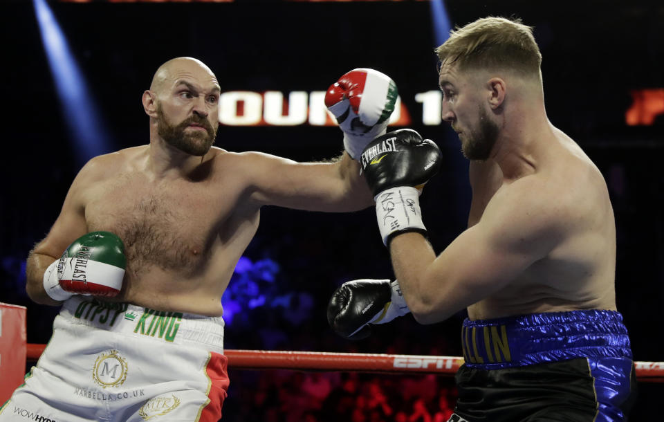 Tyson Fury, left, of England, fights Otto Wallin, of Sweden, during their heavyweight boxing match Saturday, Sept. 14, 2019, in Las Vegas. (AP Photo/Isaac Brekken)
