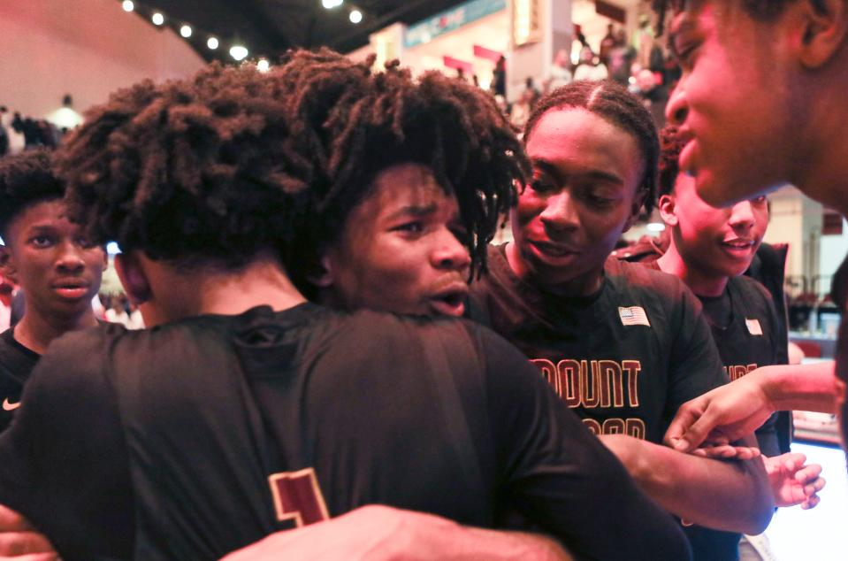 Tavern Tyler of Mount Vernon celebrates with teammates after Mount Vernon defeated New Rochelle 41-37 to win the section 1 Class AAA Boys Basketball Championship at The Westchester County Center in White Plains March 3, 2024.