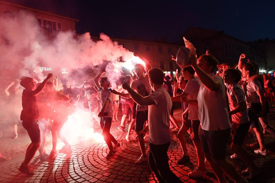 <p>People celebrate France’s victory in Marseille hold harbour on July 10, 2018 after the final whistle of the Russia 2018 World Cup semi-final football match between France and Belgium. (Photo by Anne-Christine POUJOULAT / AFP) </p>