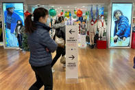 A sign pointing shoppers to self-checkout stations is shown at a store in New York on Wednesday, Dec. 6, 2023. Self-checkout faces a reckoning of sorts just as retailers are in the midst of their busiest time of the year. (AP Photo/Anne D'Innocenzio)