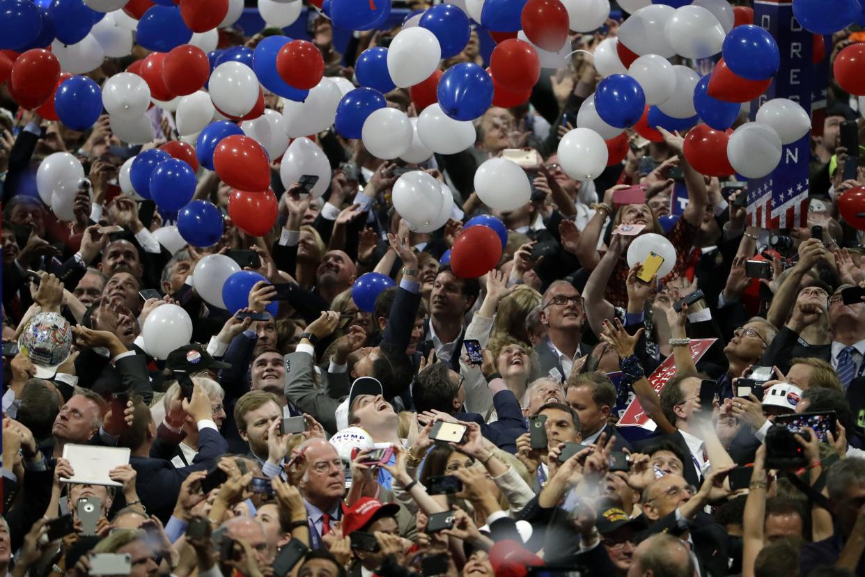 In this July 21, 2016, file photo, confetti and balloons fall during celebrations after Republican presidential candidate Donald Trump's acceptance speech on the final day of the Republican National Convention in Cleveland. 