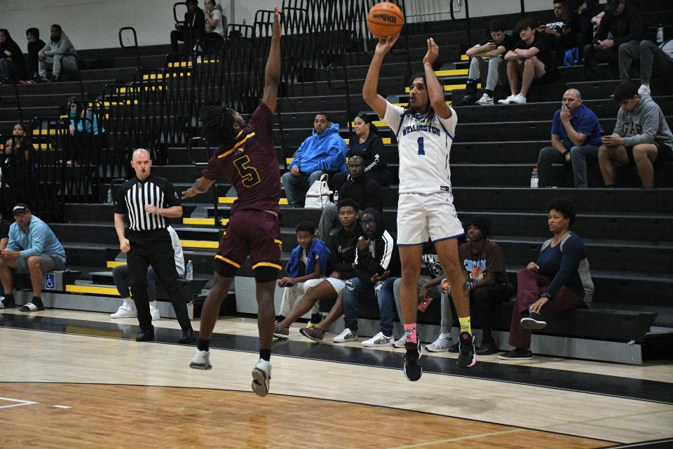 Wellington's Sean Standifer (1) shoots during the South County Martin Luther King Classic on Monday, Jan. 16, 2023.