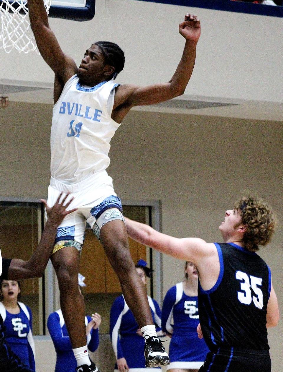 Bartlesville High's Caleb Rogers soars high to the rim during the season home opener on Dec. 2, 2022, against Sapulpa High.