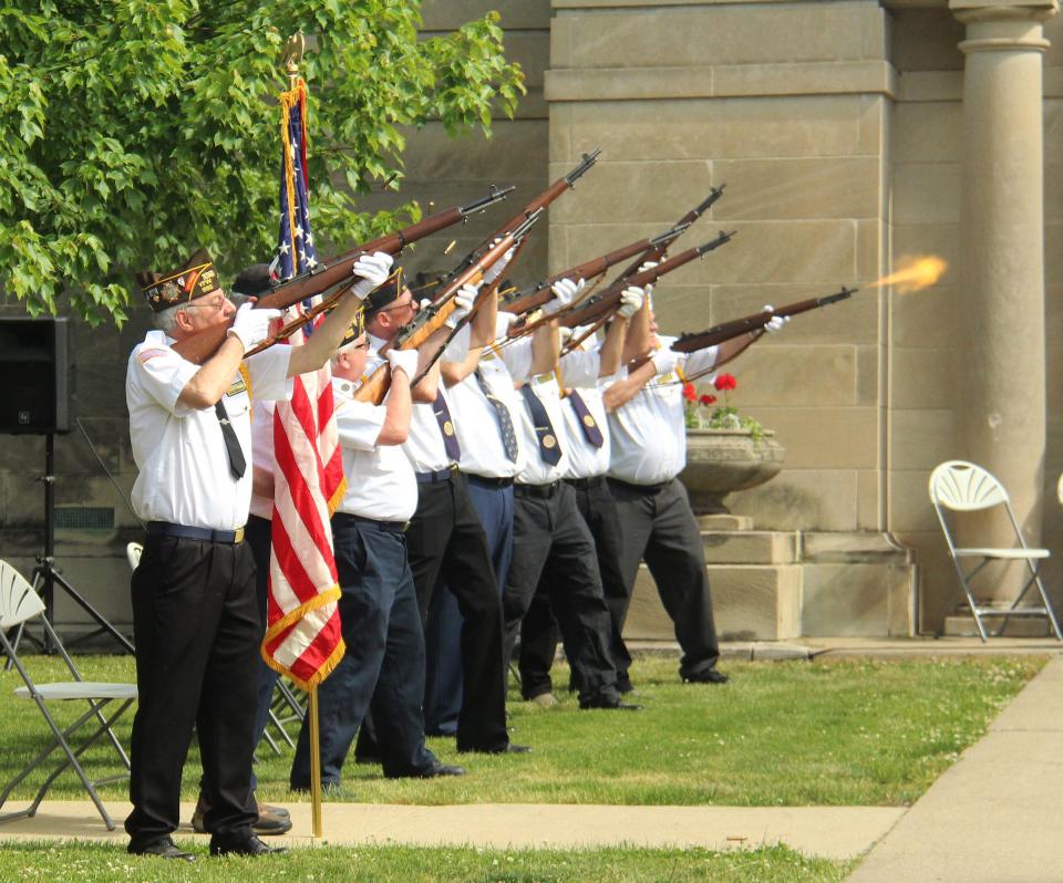 The color guard fires its 21-gun salute in honor of those members of the military who have died.
