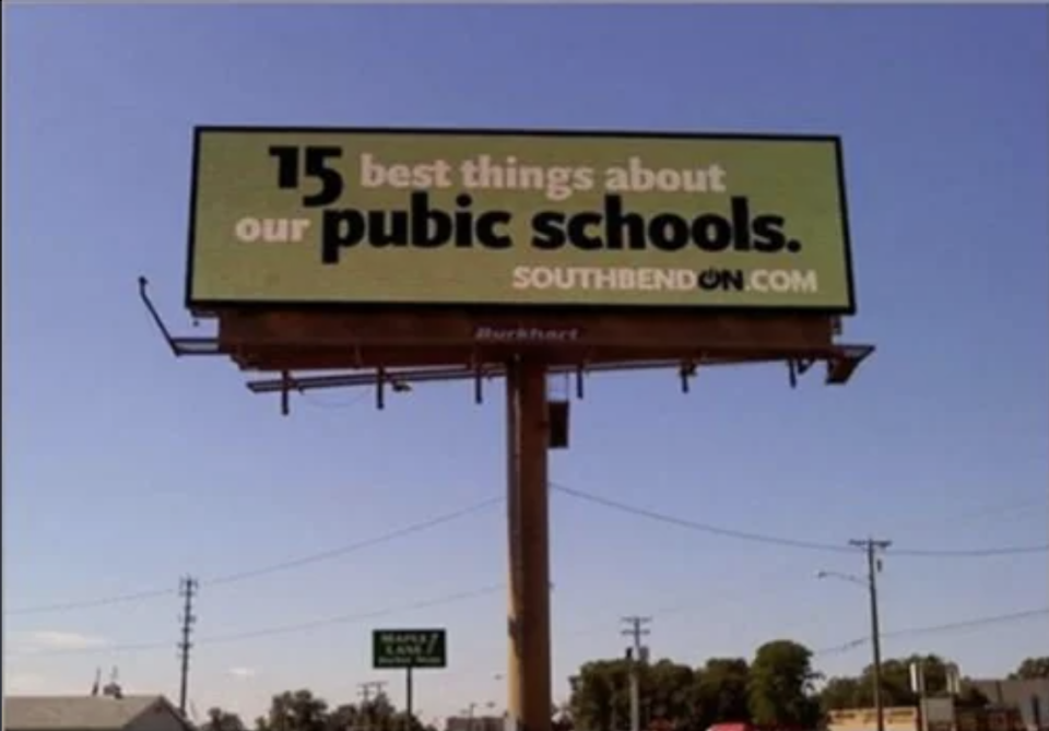 Billboard with a typo advertising "15 best things about our pubic schools."