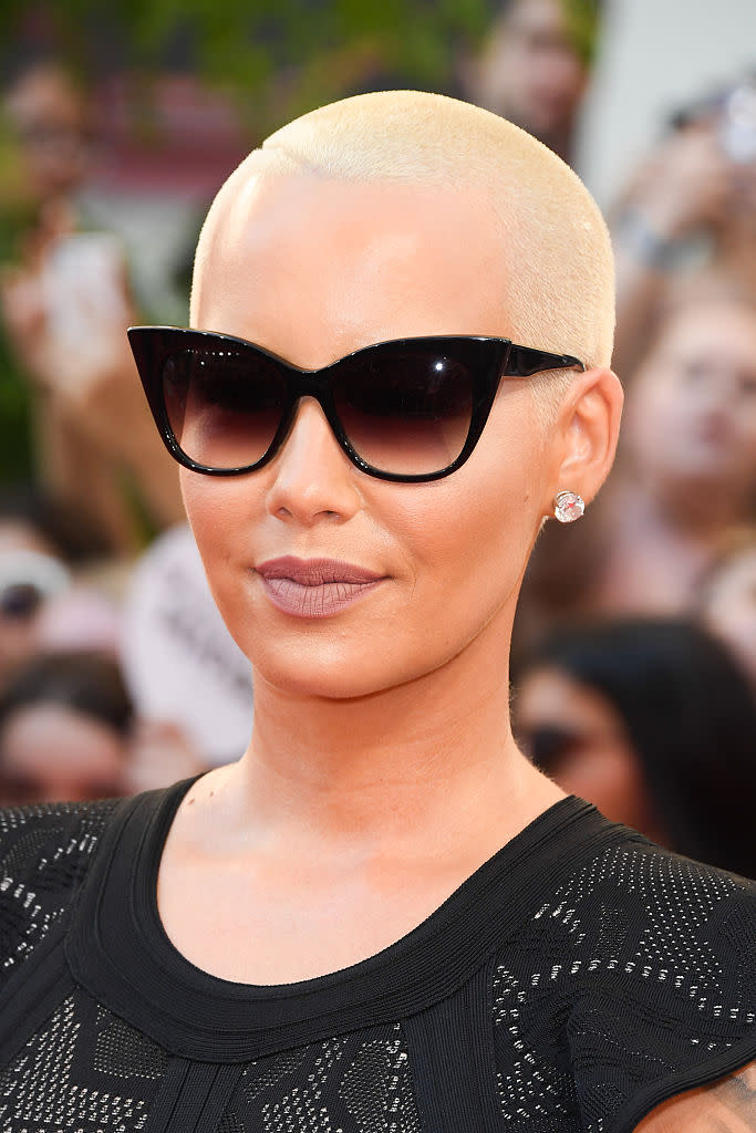 <p>Rocking her signature bleach blond coif with a nude lip (and of course, sunglasses).<i> (Photo by George Pimentel/WireImage)</i><br></p>