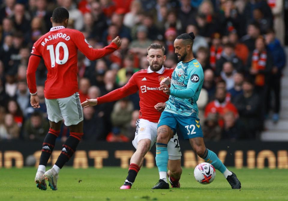 Luke Shaw challenges Theo Walcott in the early stages (Reuters)