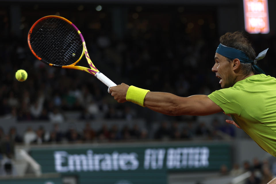 Spain's Rafael Nadal returns the ball to Serbia's Novak Djokovic during their quarterfinal match of the French Open tennis tournament at the Roland Garros stadium Tuesday, May 31, 2022 in Paris. (AP Photo/Jean-Francois Badias)