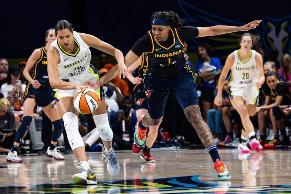 Dallas Wings center Stephanie Scares (10) gets the ball knocked away from Indiana Fever forward NaLyssa Smith (1) in the fourth quarter of a WNBA preseason game between the Dallas Wings and Indiana Fever at College Park Center in Arlington on Friday, May 3, 2024.