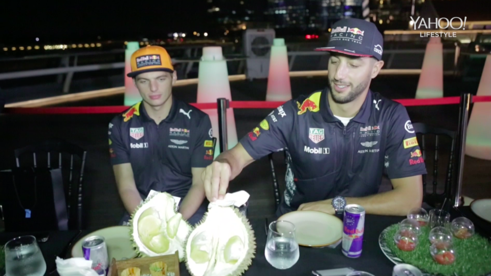 F1 racers Max Verstappen (left) and Daniel Ricciardo trying durian. (Photo: Yahoo Lifestyle Singapore)