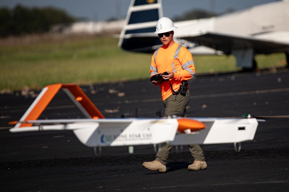 Loan Star UAS senior pilot Grady Booth lands the Commaris Seeker, a long range electric fixed-wing drone weighing less than 55-pounds, during a field test at Nueces County Airport on Friday, Sept. 29, 2023, in Robstown, Texas.