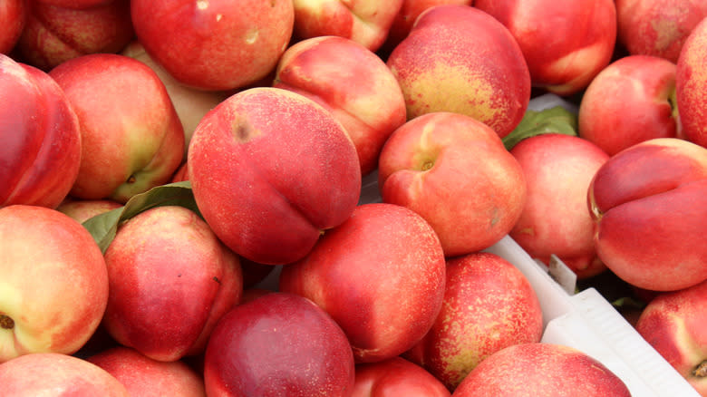 Pile of bright red peaches