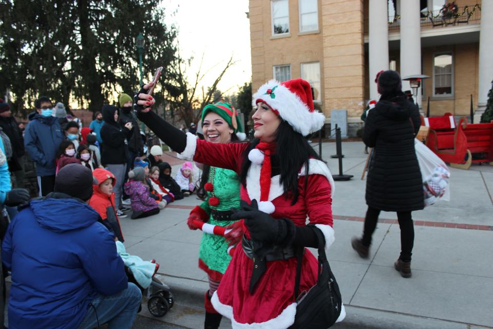 Hundreds gathered at the Historic Courthouse Plaza in Hendersonville Friday, Nov. 26, 2021 awaiting the arrival of Santa Claus and to see the lights on the Christmas tree come to life.