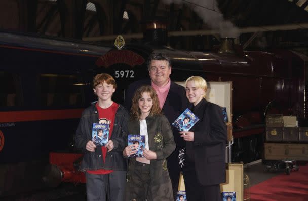 PHOTO: In this May 8, 2002, file photo, Robbie Coltrane, Rupert Grint, Emma Watson and Tom Felton appear at the 'Harry Potter and The Philosopher's Stone' DVD launch party held on platform 9 3/4, King's Cross Station in London. (Dave Benett/Getty Images, FILE)