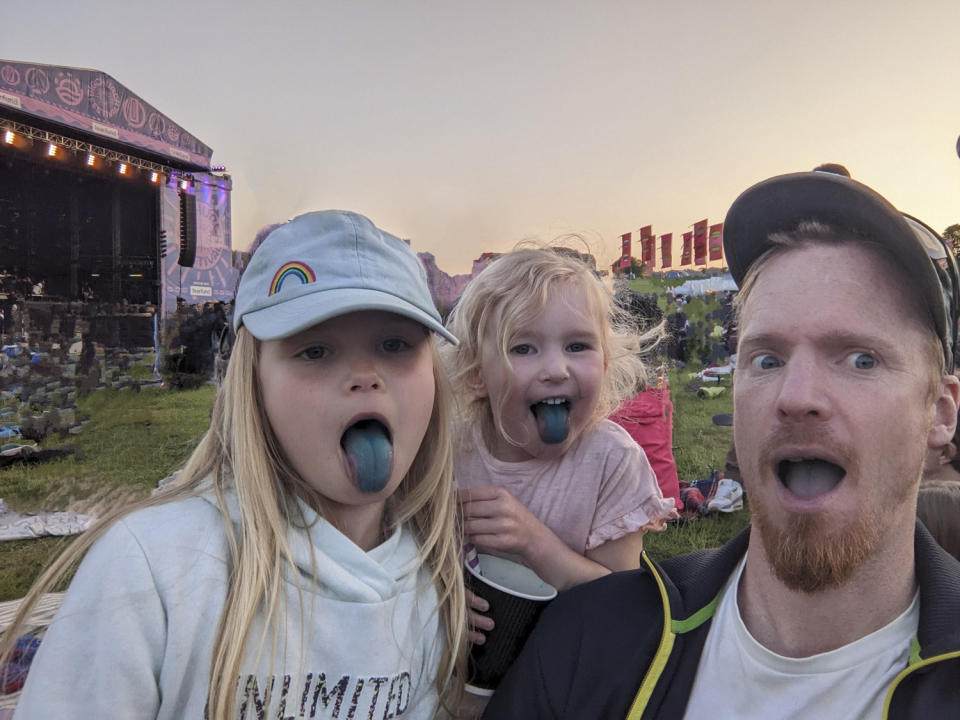 Family portrait at festival with all Google Magic Eraser suggestions accepted