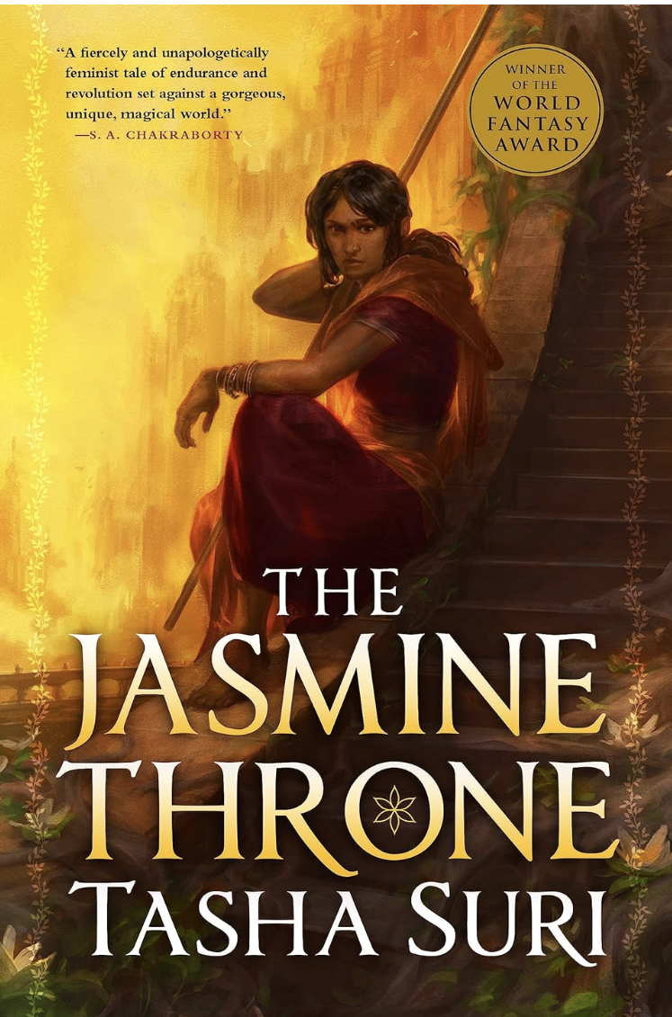 Book cover of "The Jasmine Throne" by Tasha Suri shows a seated woman in a red dress with a golden background. The series is The Burning Kingdoms Book 1