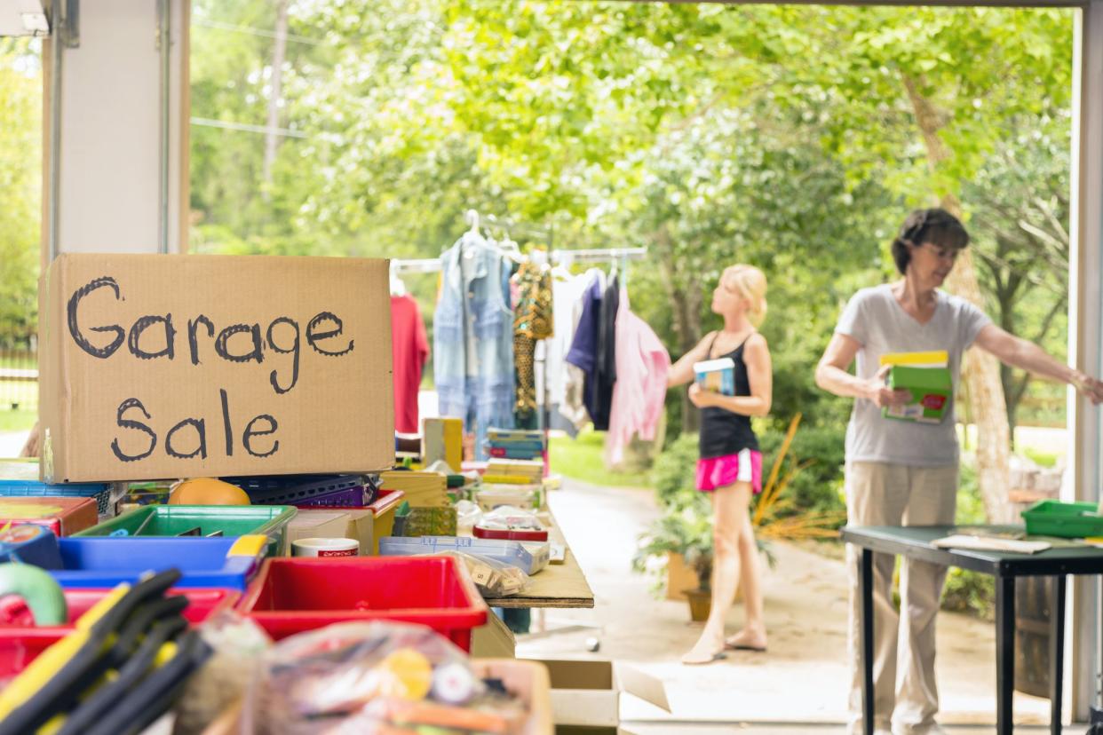 people looking through things at garage sale