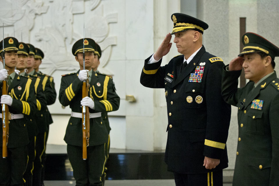 U.S. Army Chief of Staff Gen. Raymond Odierno, second from right, and Gen. Wang Ning, right, deputy Chief Staff of the People's Liberation Army (PLA), salute as they review an honor guard at China's Ministry of Defense in Beijing, Friday, Feb. 21, 2014. The U.S. Army chief met with top Chinese generals in Beijing Friday amid regional tensions and efforts to build trust between the two nation's militaries. (AP Photo/Alexander F. Yuan, Pool)