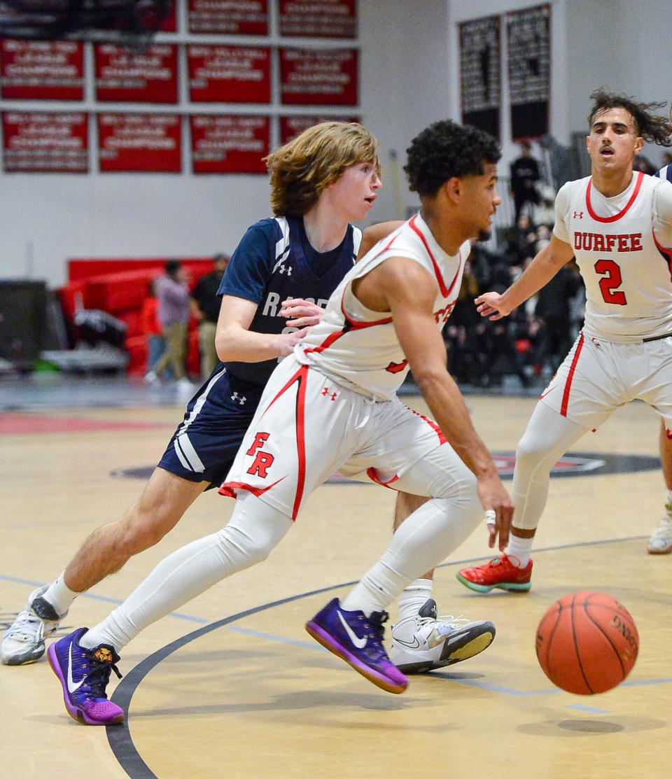 Durfee’s Jeyden Espinal dribbles past Somerset Berkley’s Dom Taylor during a game last season.