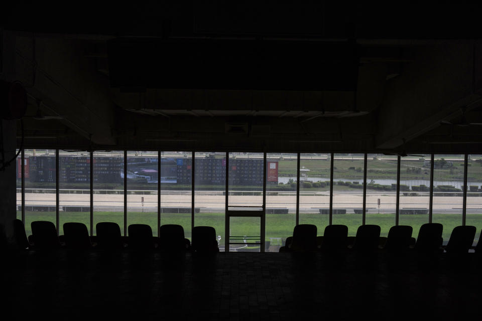 Abandoned tribunes at the Macao Jockey Club in Macao, Saturday, March 30, 2024. After more than 40 years, Macao’s horse racing track hosted its final races on Saturday, bringing an end to the sport in the city famous for its massive casinos. (AP Photo/Louise Delmotte)