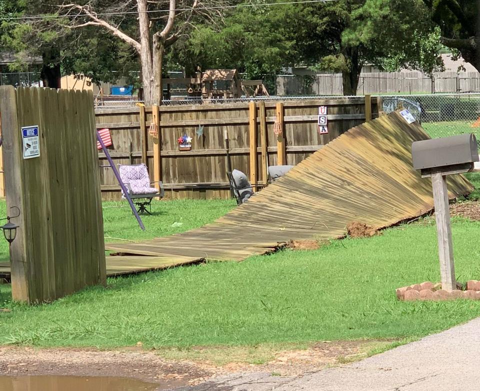 High winds knocked down a fence near Jenny Lind Road and Jackson Street early Friday, July 14, 2023 in Fort Smith.