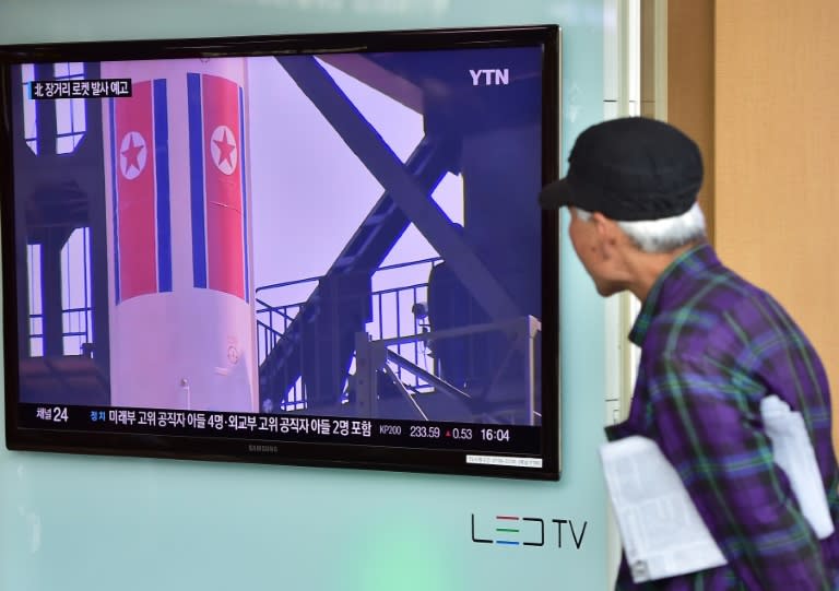 A man watches a news report at a railway station in Seoul on September 15, 2015, on the confirmation from North Korea that the nuclear reactor seen as the country's main source of weapons-grade plutonium had resumed normal operations