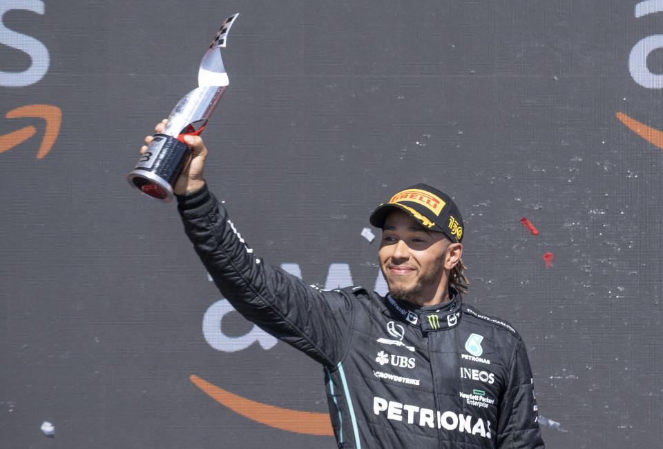 Mercedes Team driver Lewis Hamilton, of Great Britain, celebrates after taking third place at the Canadian Grand Prix in Montreal on Sunday, June 19, 2022. (Paul Chiasson/The Canadian Press via AP)