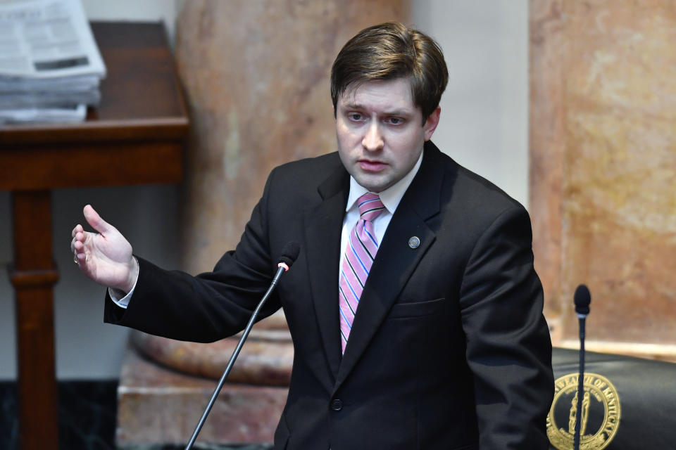 Kentucky State Rep. Daniel Elliott speaks to his fellow House members on Ky. Senate Bill 4, an act relating to warrants authorizing entry without notice on the last day of the legislature at the Kentucky State Capitol in Frankfort, Ky., Tuesday, March 30, 2021. (AP Photo/Timothy D. Easley)