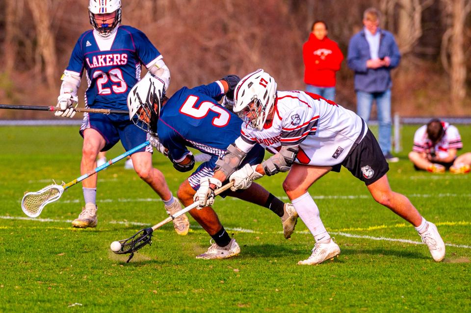 Old Rochester's Harrison Hughes scoops the loose ball after winning the face off.