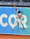 Boston Red Sox right fielder Alex Verdugo comes up short as he leaps for a double off the wall hit by Tampa Bay Rays' Yandy Diaz during the first inning of a baseball game Wednesday, Aug. 5, 2020, in St. Petersburg, Fla. (AP Photo/Steve Nesius)