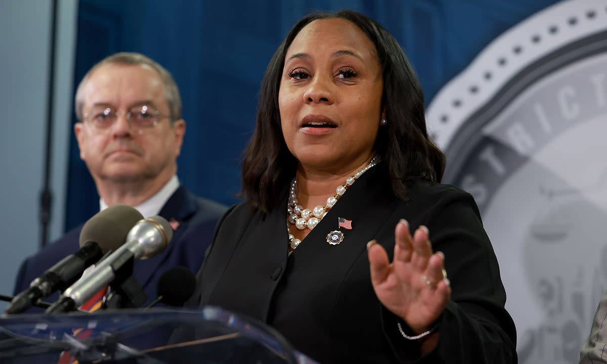 A news photo of Fulton County District Attorney Fani Willis speaking at a press conference