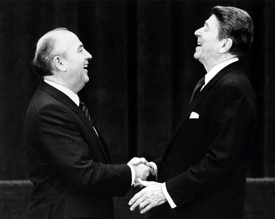 U.S. President Ronald Reagan (R) shakes hands at his first meeting with Soviet leader Mikhail Gorbachev to sign an arms treaty in Geneva, in this November 19, 1985 file photo. The two leaders met for the first time to hold talks on international diplomatic relations and the arms race.  REUTERS/Denis Paquin/Files (SWITZERLAND - Tags: POLITICS PROFILE TPX IMAGES OF THE DAY)  ATTENTION EDITORS - THIS PICTURE IS PART OF PACKAGE '30 YEARS OF REUTERS PICTURES'  TO FIND ALL 56 IMAGES SEARCH '30 YEARS'