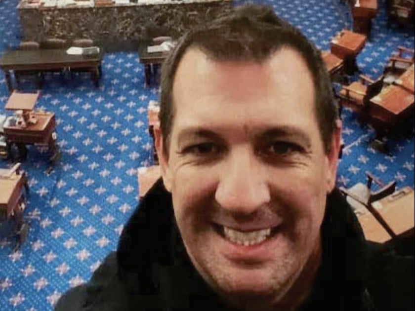 Convicted Capitol riot participant Anthony Mariotto grins for a selfie in the Senate Chamber (Department of Justice)