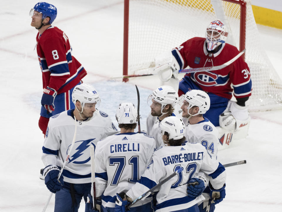 Tampa Bay Lightning's Alex Barre-Boulet (12) celebrates his goal against Montreal Canadiens goaltender Jake Allen with teammates during the first period of an NHL hockey game, Tuesday, Nov. 7, 2023 in Montreal. (Christinne Muschi/The Canadian Press)