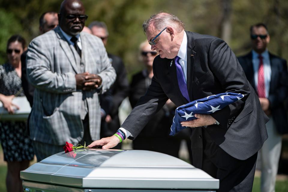 Former Centenary University president Bruce Murphy places a flower on top of the casket of his wife, U.S. Army Col. Jeanne Picariello Murphy, following her funeral service at Arlington National Cemetery on April 12. Jeanne Murphy died in a hit-and-run accident in Hackettstown in January.