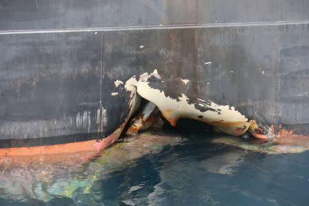 FILE PHOTO: A damaged ANDREA VICTORY ship is seen off the Port of Fujairah, United Arab Emirates, May 13, 2019. REUTERS/Satish Kumar